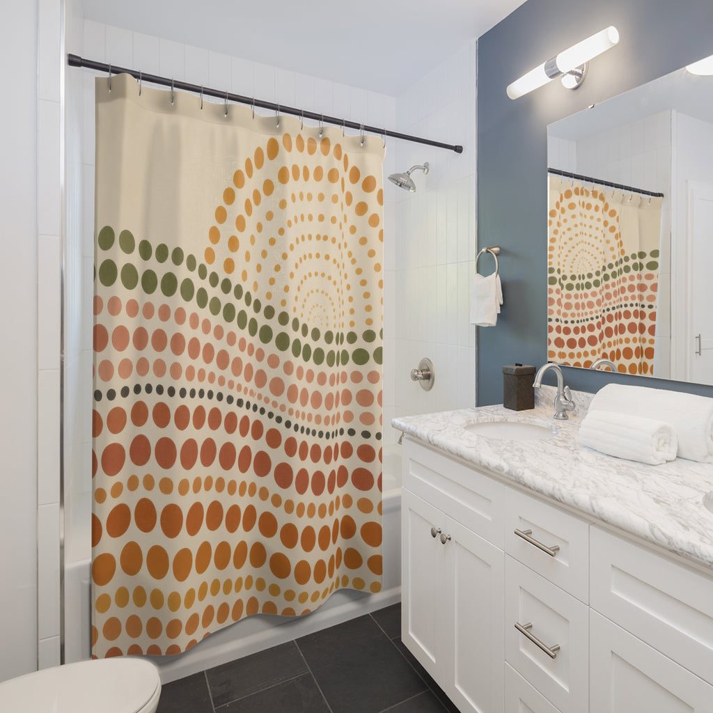 Terracotta polka dot waves with a rising sun shower curtain beside a white vanity