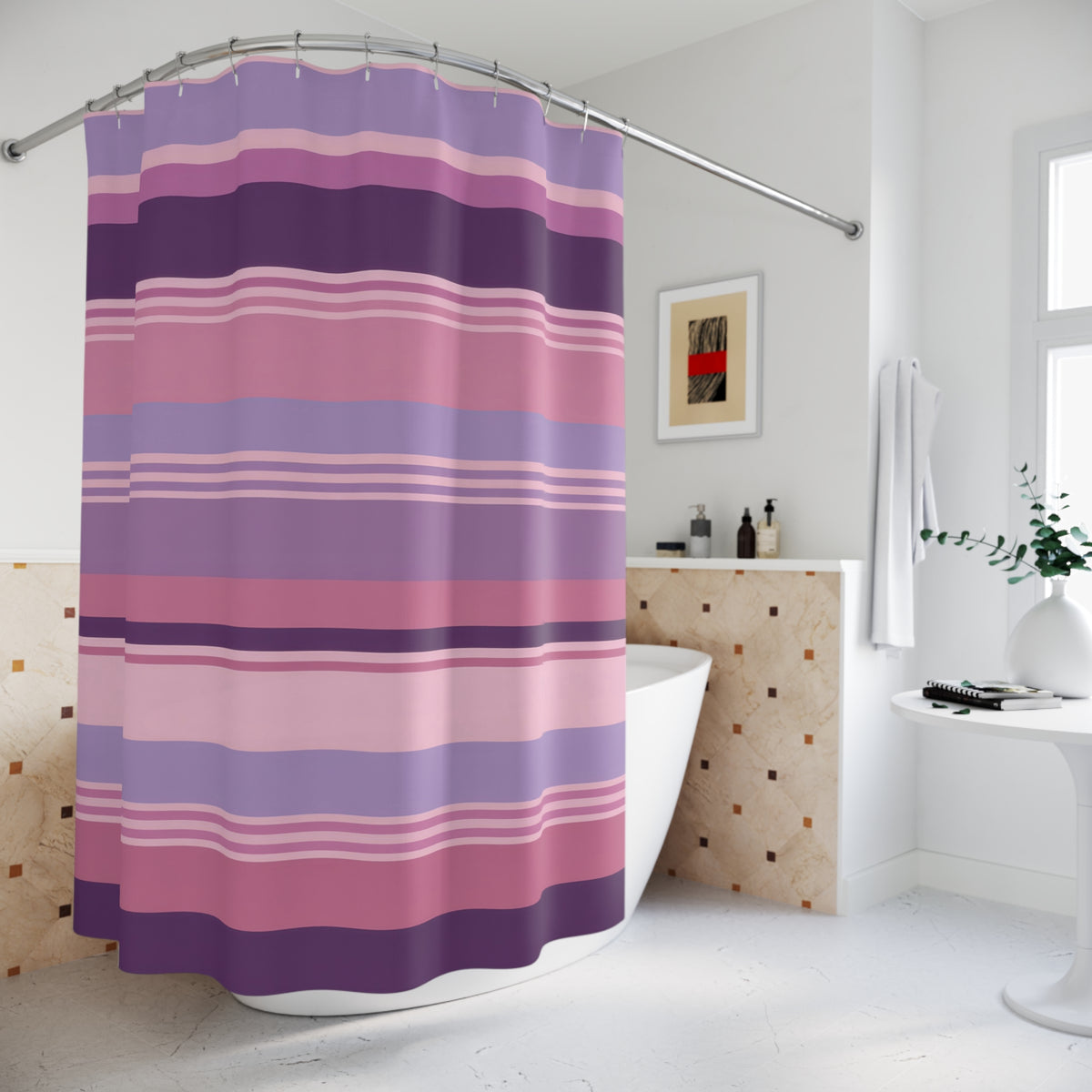 Horizontal stripes in dusty rose pink, lavender and plum shower curtain beside a freestanding tub
