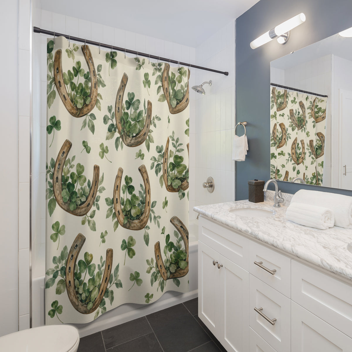 Brown horseshoes with sage clovers on cream shower curtain beside a white vanity