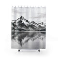 Snowy black and gray mountains reflected in a pale lake shower curtain with full front view