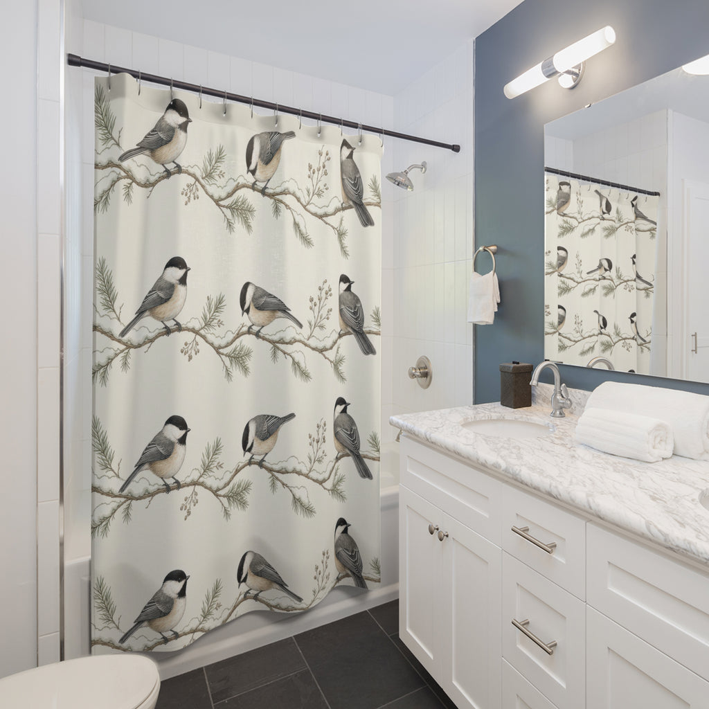 Chickadees on snowy branch stripes shower curtain beside a white vanity