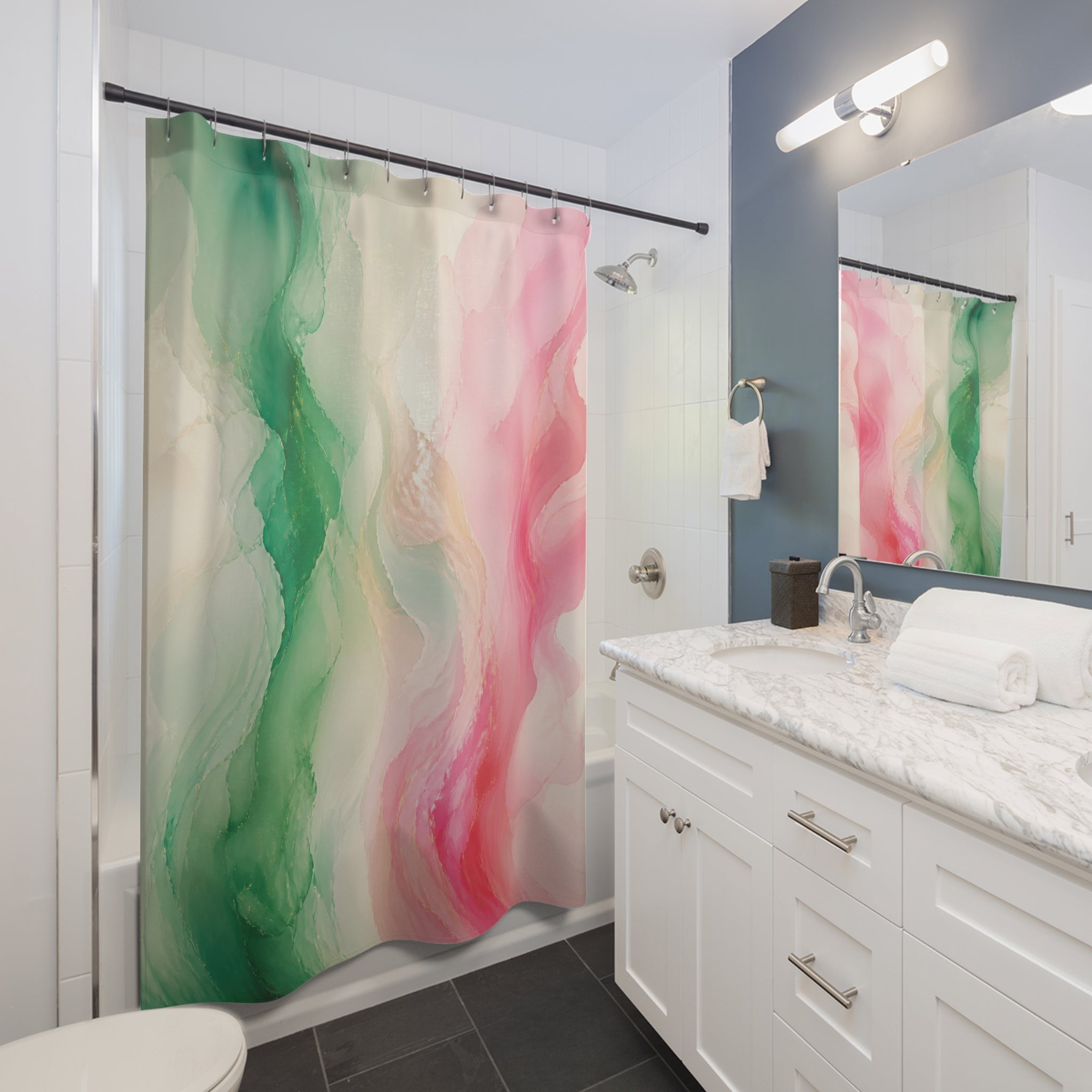 Green and pink sweeping ribbon color field shower curtain beside a white vanity