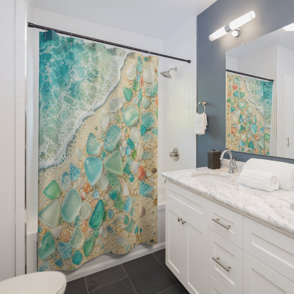 Sea glass and shells beside a turquoise shoreline shower curtain installed beside a white vanity