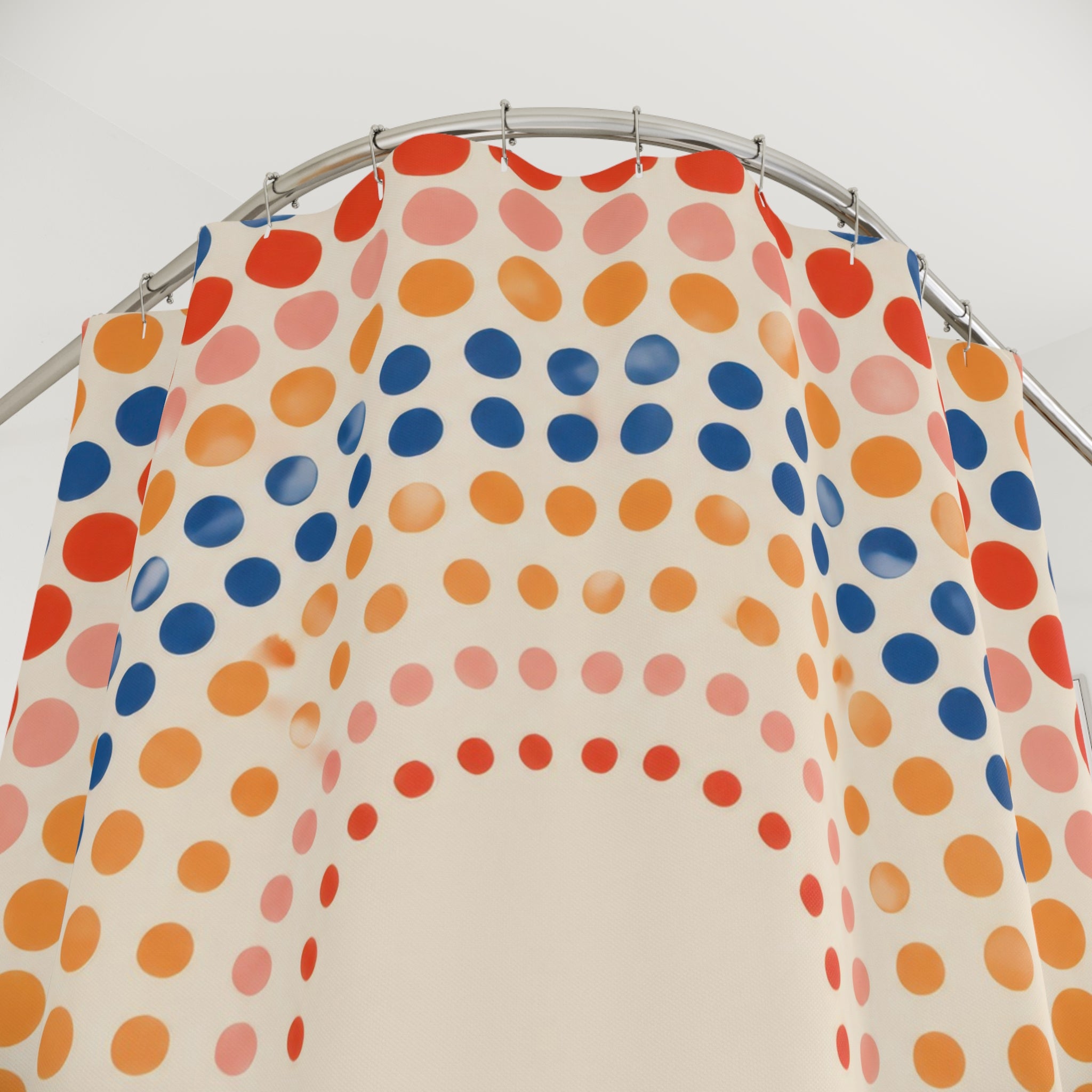 Coral and navy concentric polka dots shower curtain with close-up print, hooks, and folds