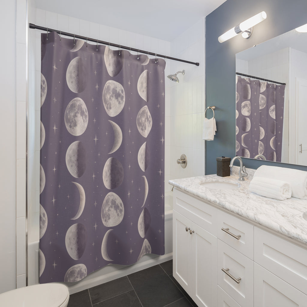 Pearl moon phases and small stars on dusty lavender shower curtain beside a white vanity