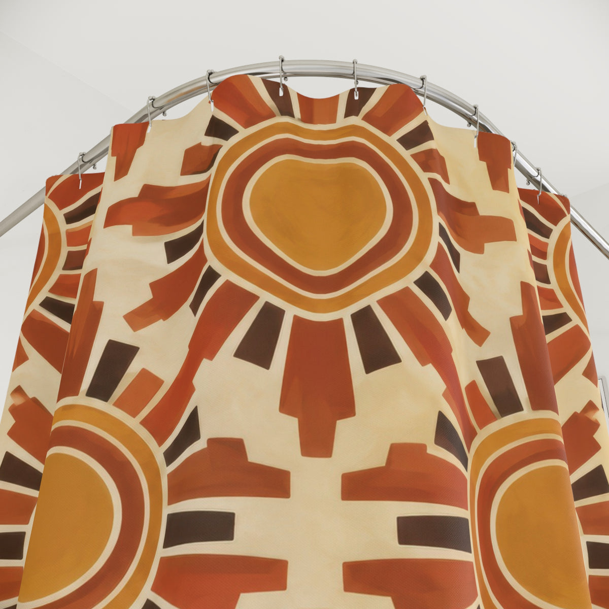 Ochre suns with terracotta rays on cream shower curtain with close-up print, hooks, and folds