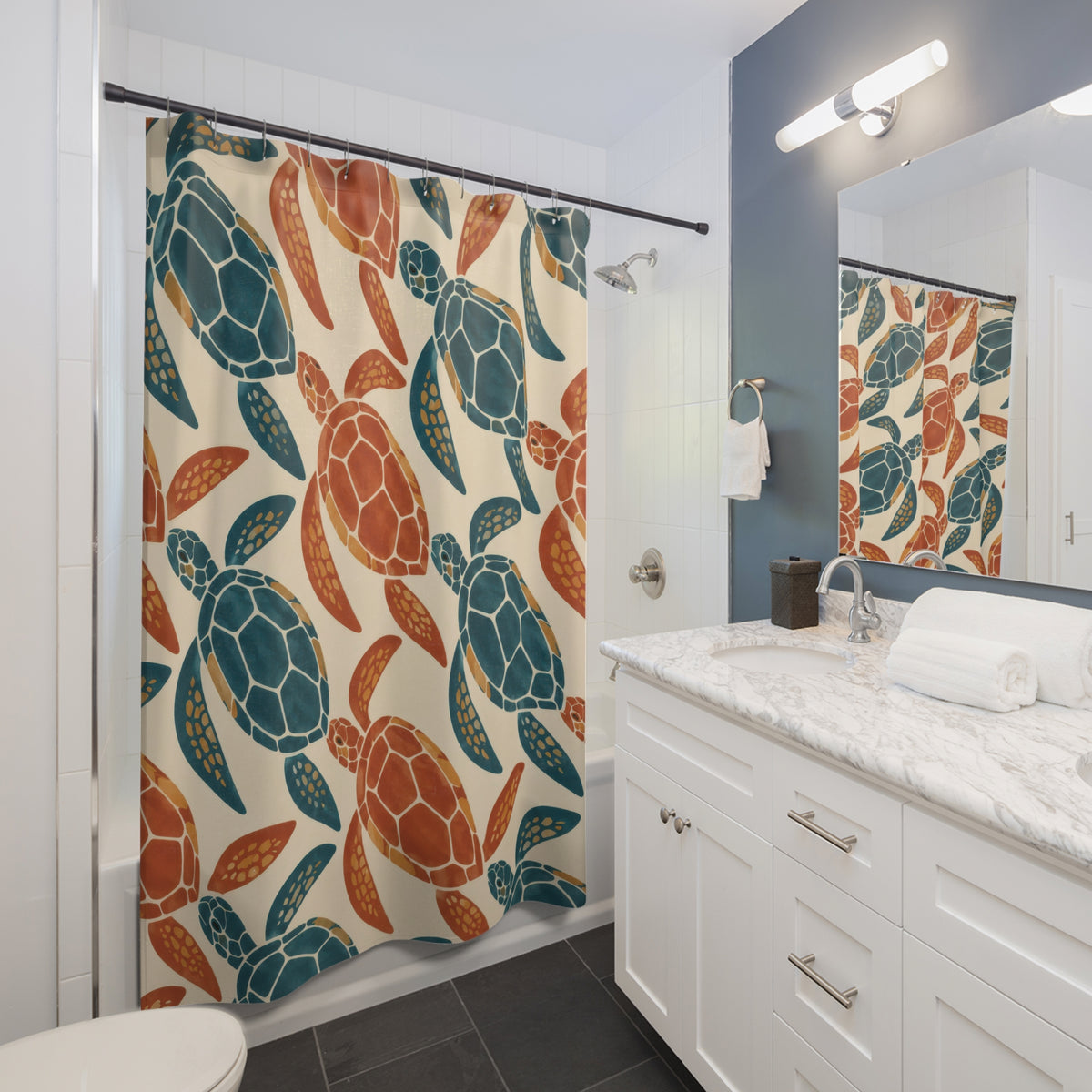 Teal and terracotta sea turtle pattern shower curtain beside a white vanity