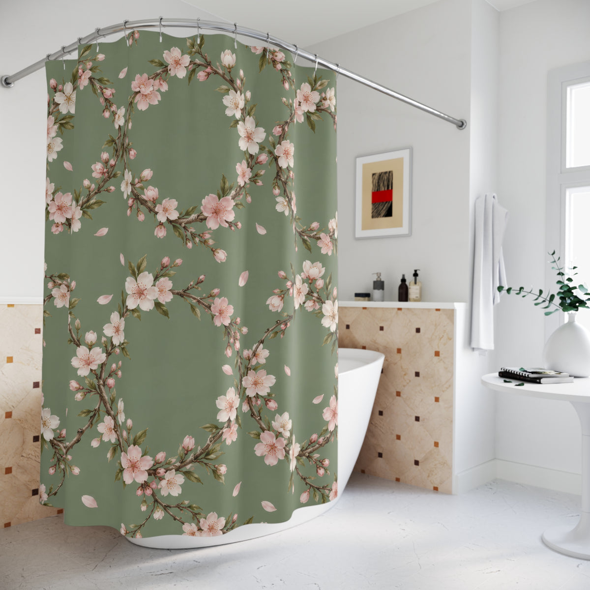 Cream and pink cherry blossom wreaths on sage green shower curtain beside a freestanding tub