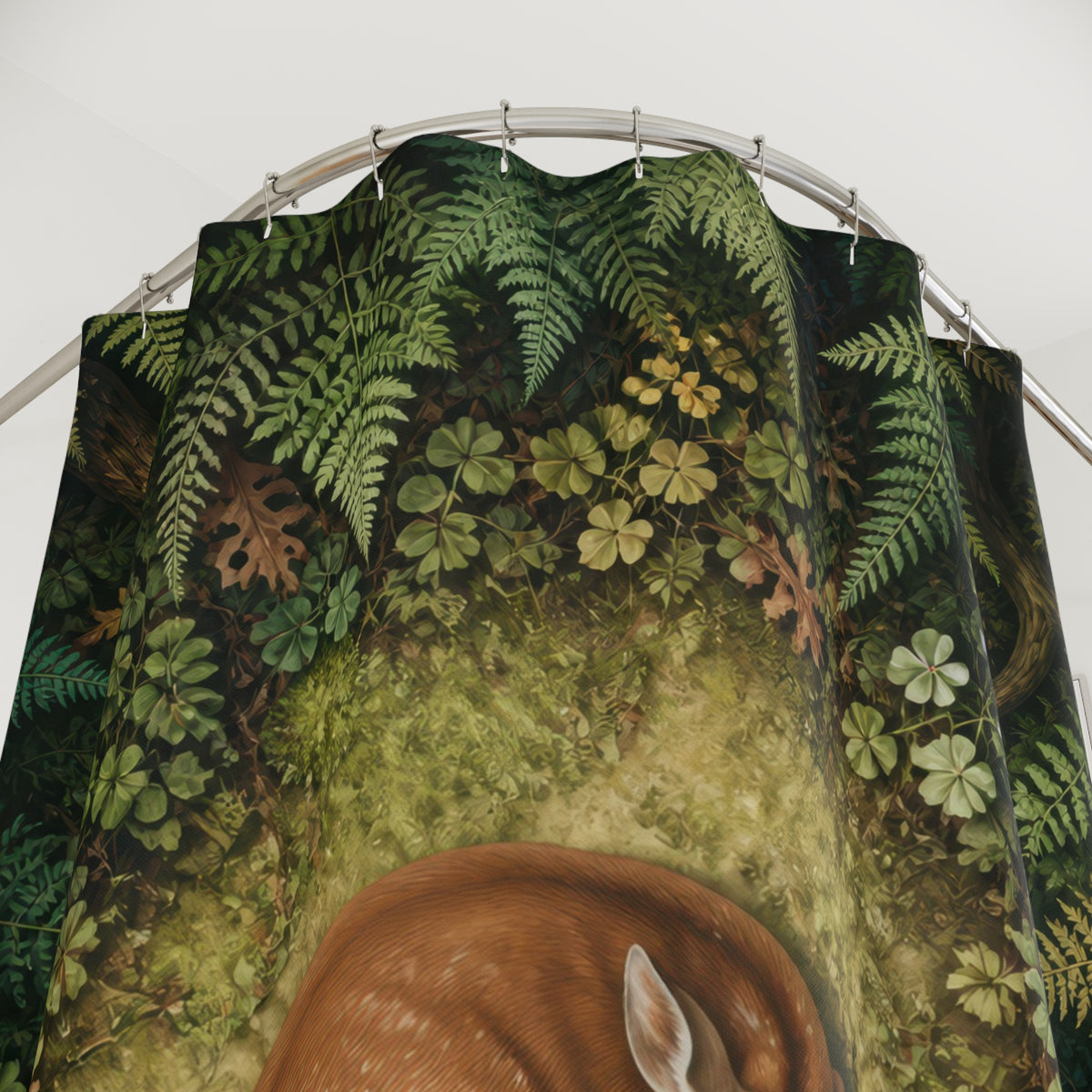 Resting fawn in a circular woodland fern clearing shower curtain with close-up print, hooks, and folds
