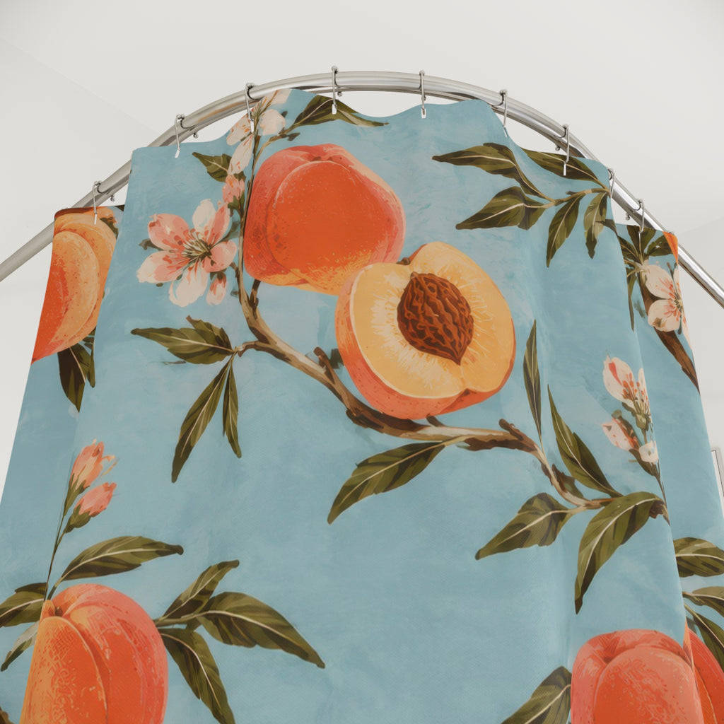 Peaches and leafy branches on pale blue shower curtain with close-up print, hooks, and folds