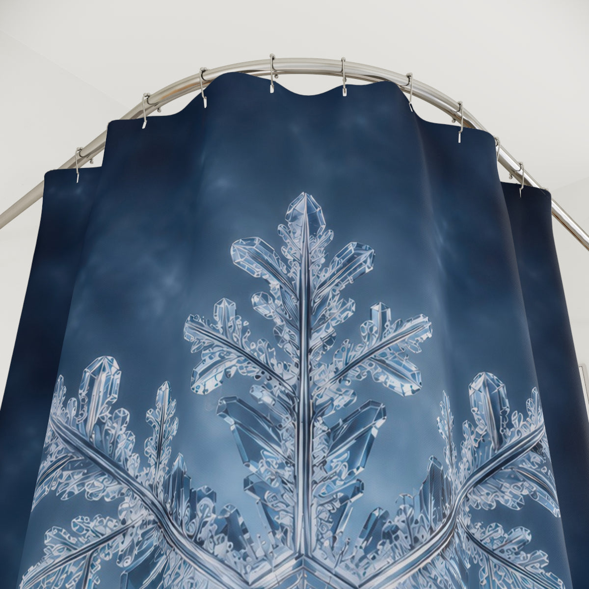 Single ice blue snowflake on a clouded navy background shower curtain with close-up print, hooks, and folds