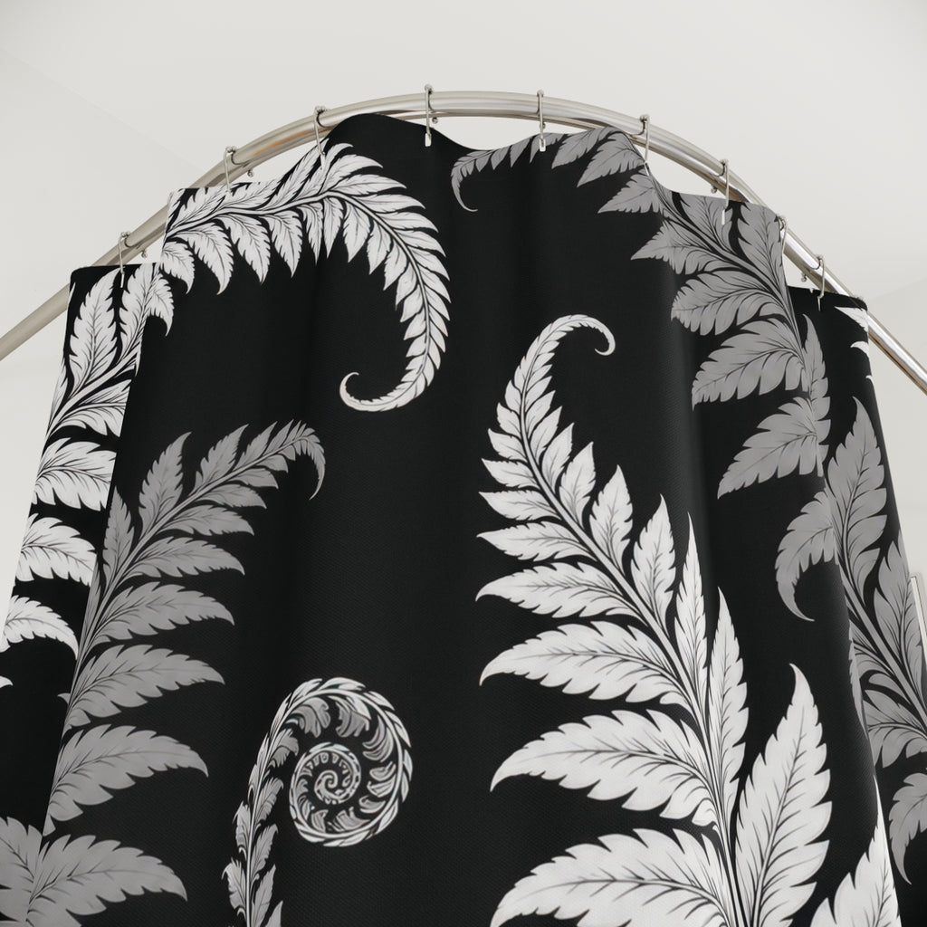 White and gray curling fern fronds on a black ground shower curtain with close-up print, hooks, and folds