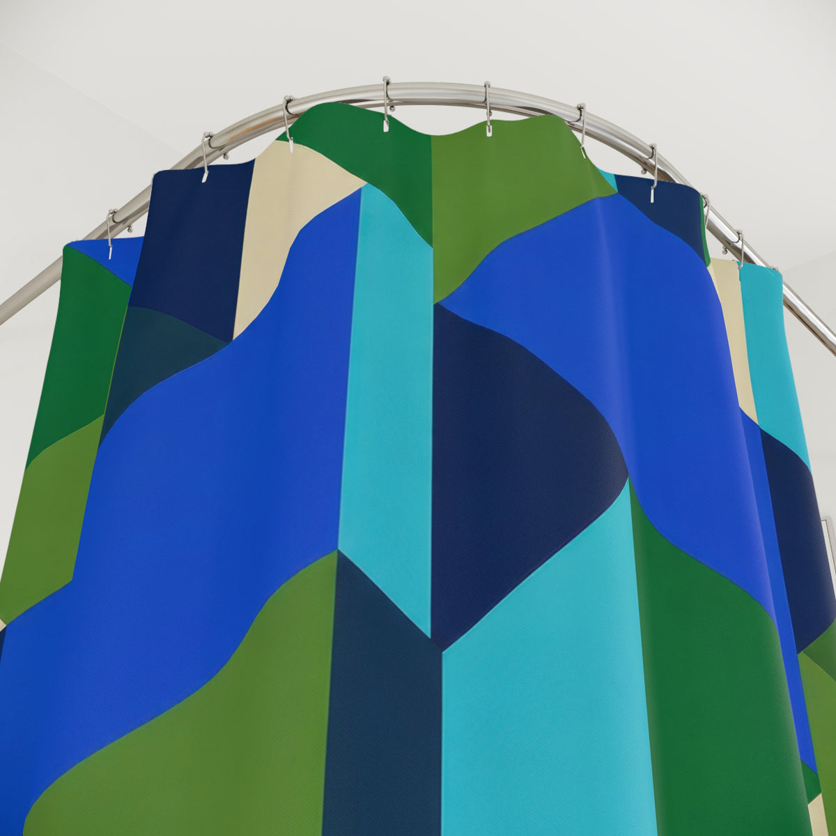 Interlocking blue, aqua and green facets with cream accents shower curtain with close-up print, hooks, and folds