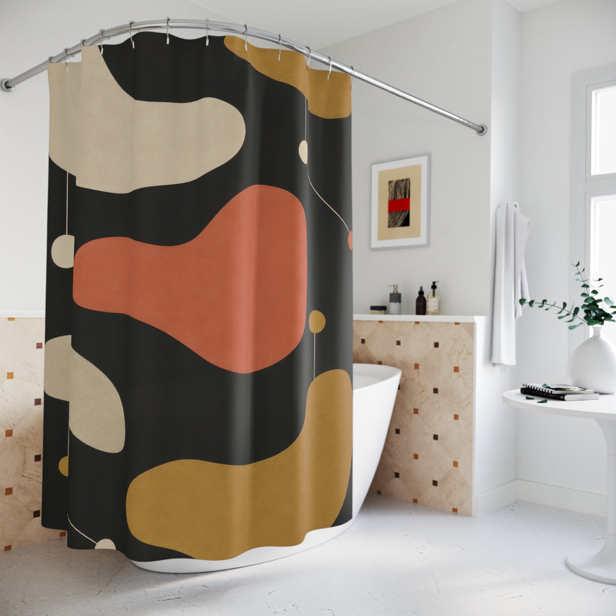 Cream, coral and ochre kidney shapes on charcoal shower curtain beside a freestanding tub