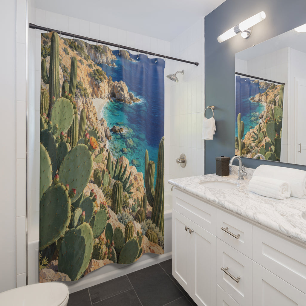 Green coastal cactus above a turquoise cove and peach cliffs shower curtain beside a white vanity