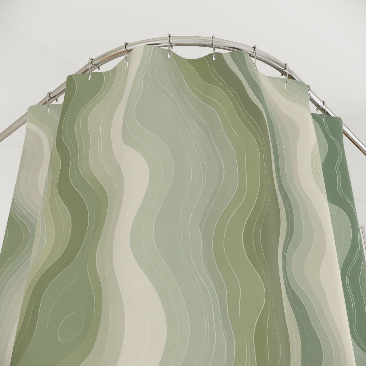 Sage green organic contour line pattern on an ivory ground shower curtain with close-up print, hooks, and folds