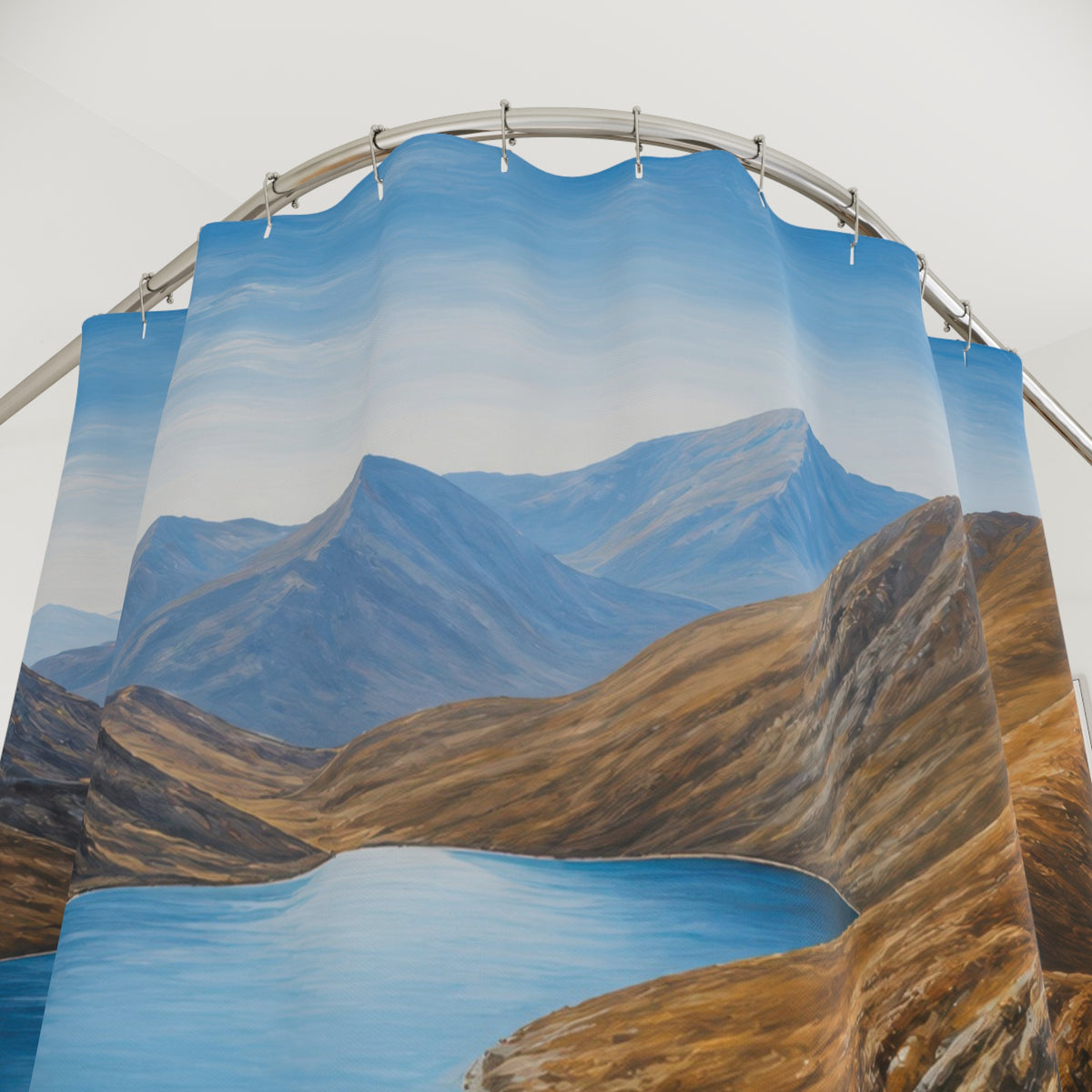 Blue alpine lake between warm brown mountain slopes shower curtain with close-up print, hooks, and folds