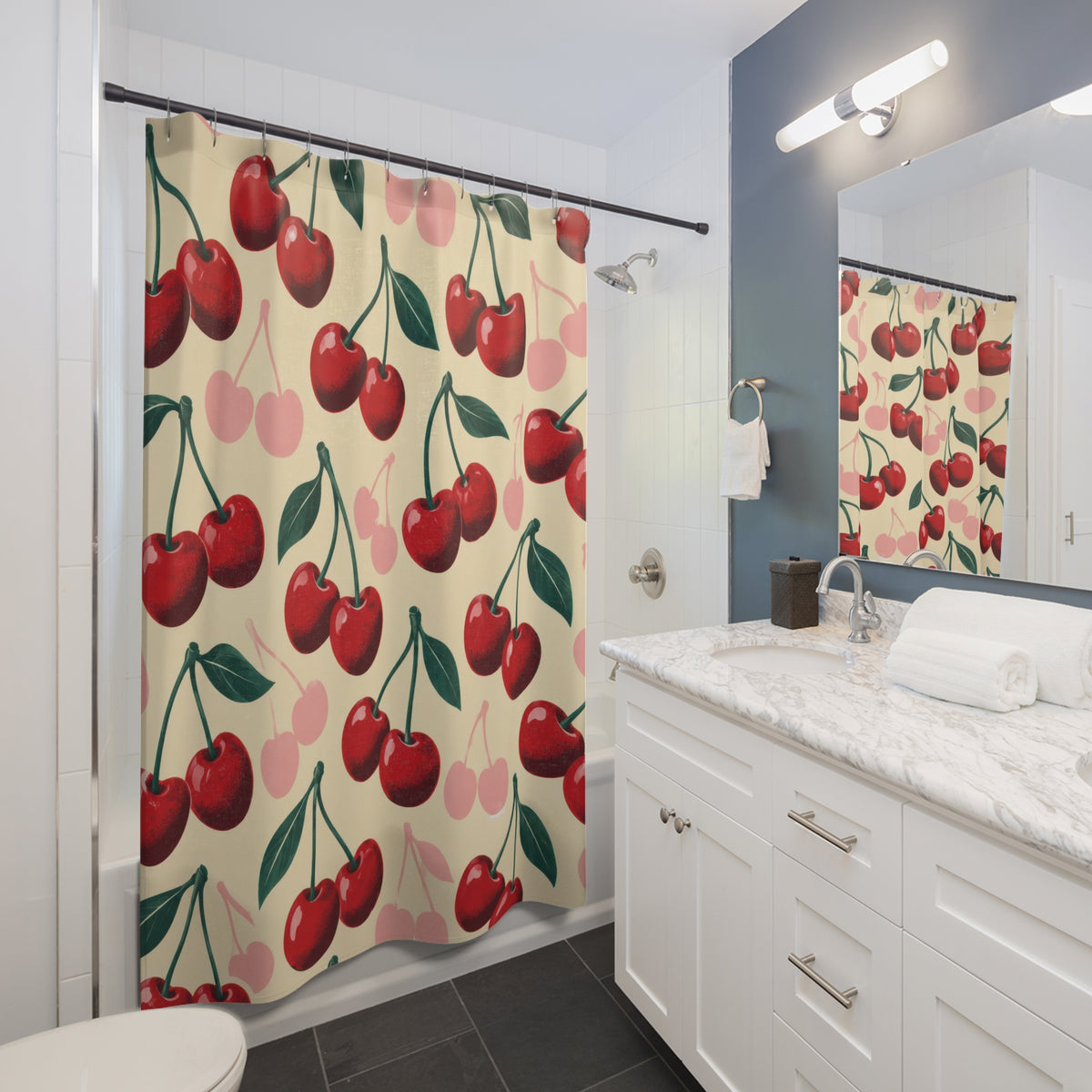 Retro red and pink cherry pattern on cream shower curtain beside a white vanity
