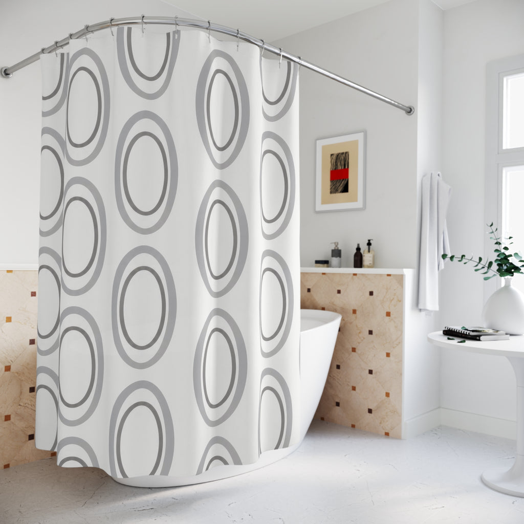 Silver gray nested ovals on white shower curtain beside a freestanding tub