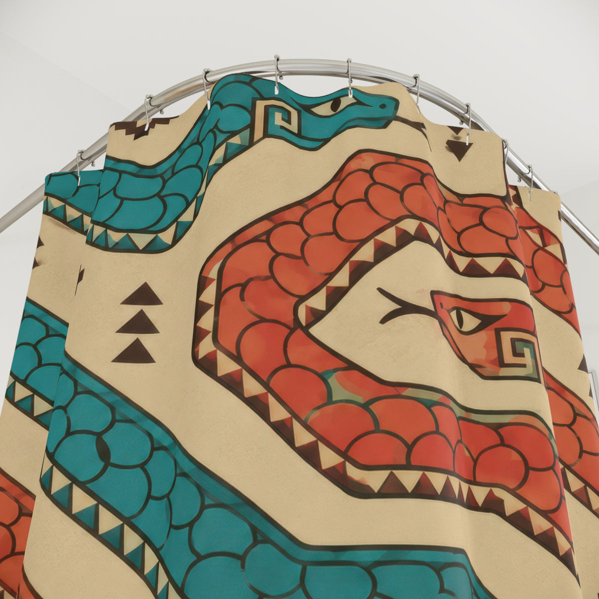 Coral and turquoise serpents on sand shower curtain with close-up print, hooks, and folds