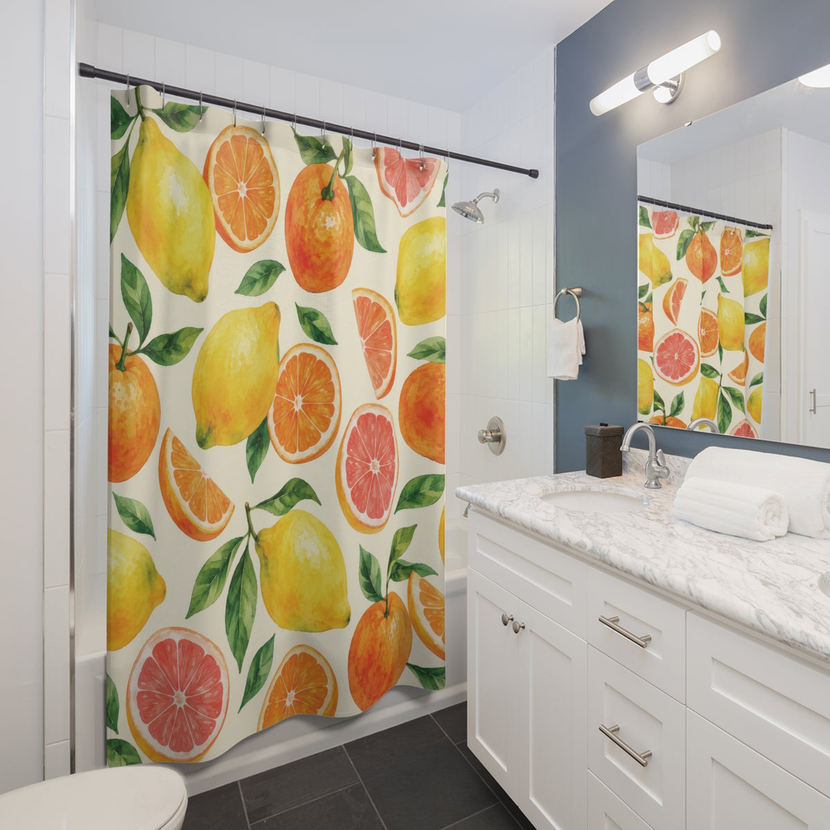 Yellow lemons, oranges and pink citrus slices with green leaves shower curtain beside a white vanity