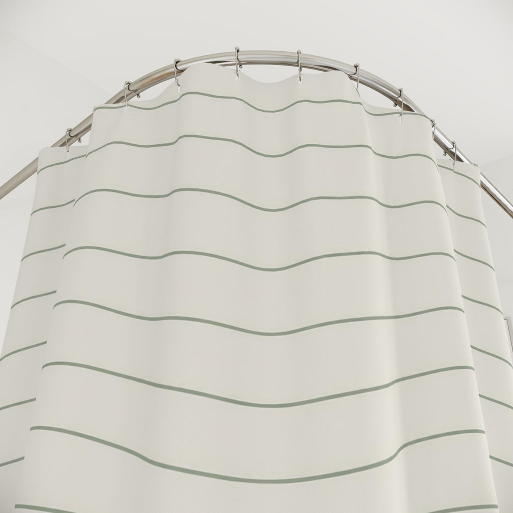 Thin sage green wave lines on warm ivory shower curtain with close-up print, hooks, and folds