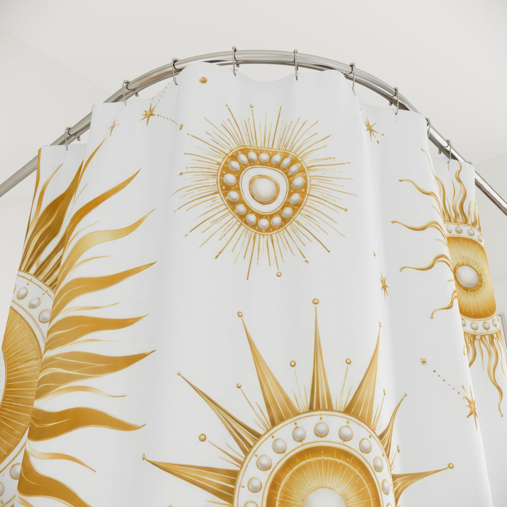 Gold sun medallions and starbursts on white shower curtain with close-up print, hooks, and folds