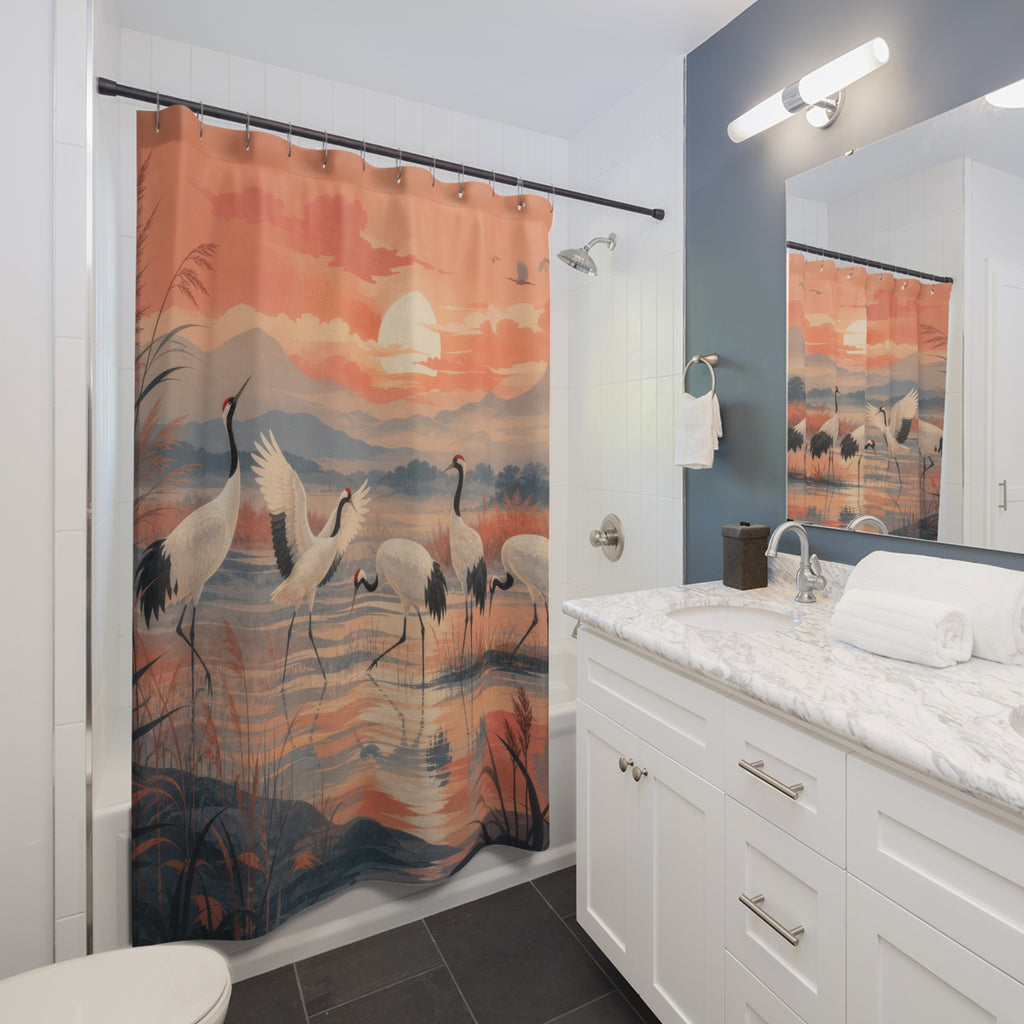 Elegant cranes crossing a coral sunrise wetland panorama shower curtain installed beside a white vanity