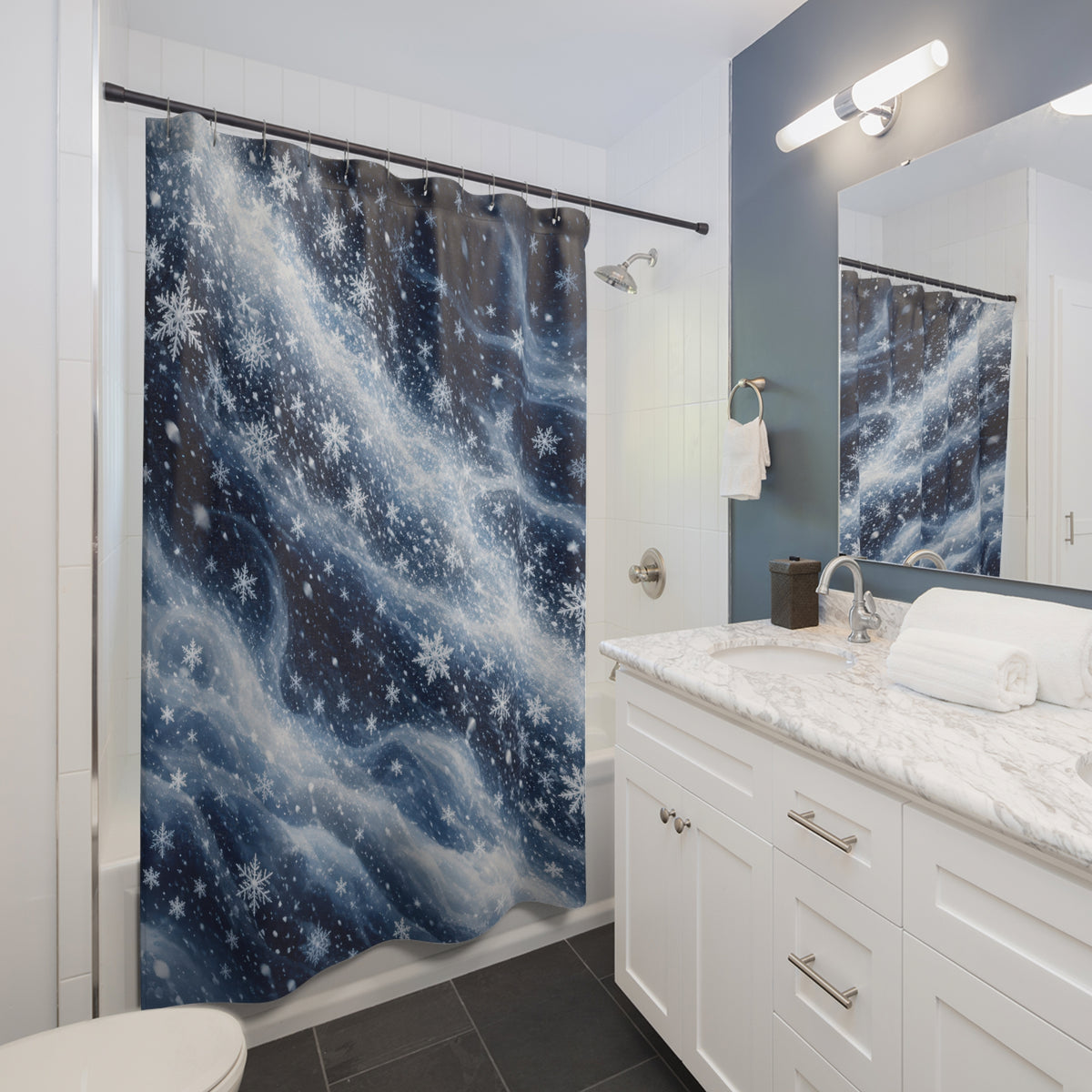 Navy swirling snowfall shower curtain beside a white vanity