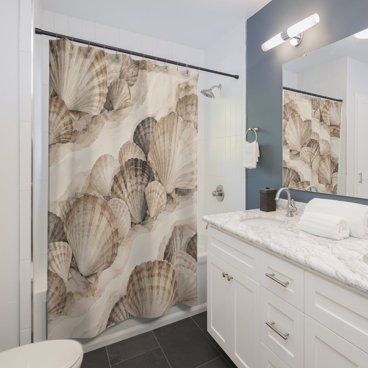 Taupe, ivory and charcoal scallop shells in diagonal clusters shower curtain beside a white vanity