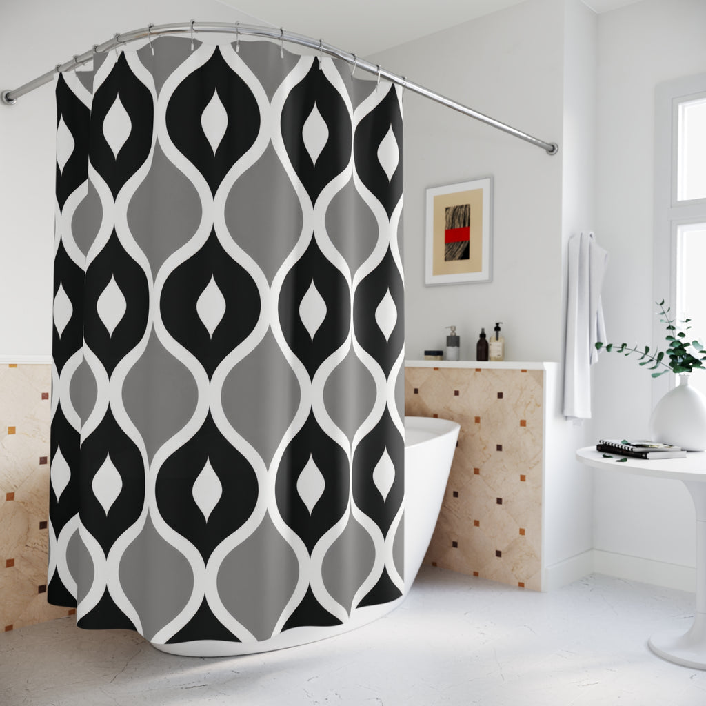 Black and gray ogees with white curved outlines shower curtain beside a freestanding tub
