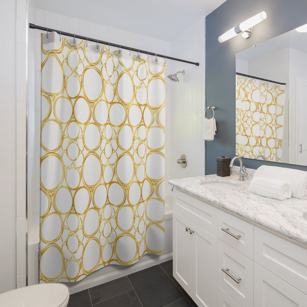Gold halo circle pattern on warm white shower curtain beside a white vanity