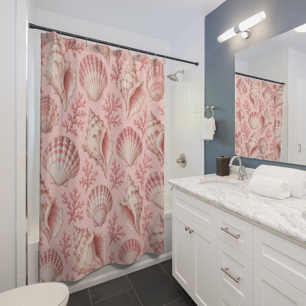 Light pink and ivory seashells with rose coral shower curtain beside a white vanity