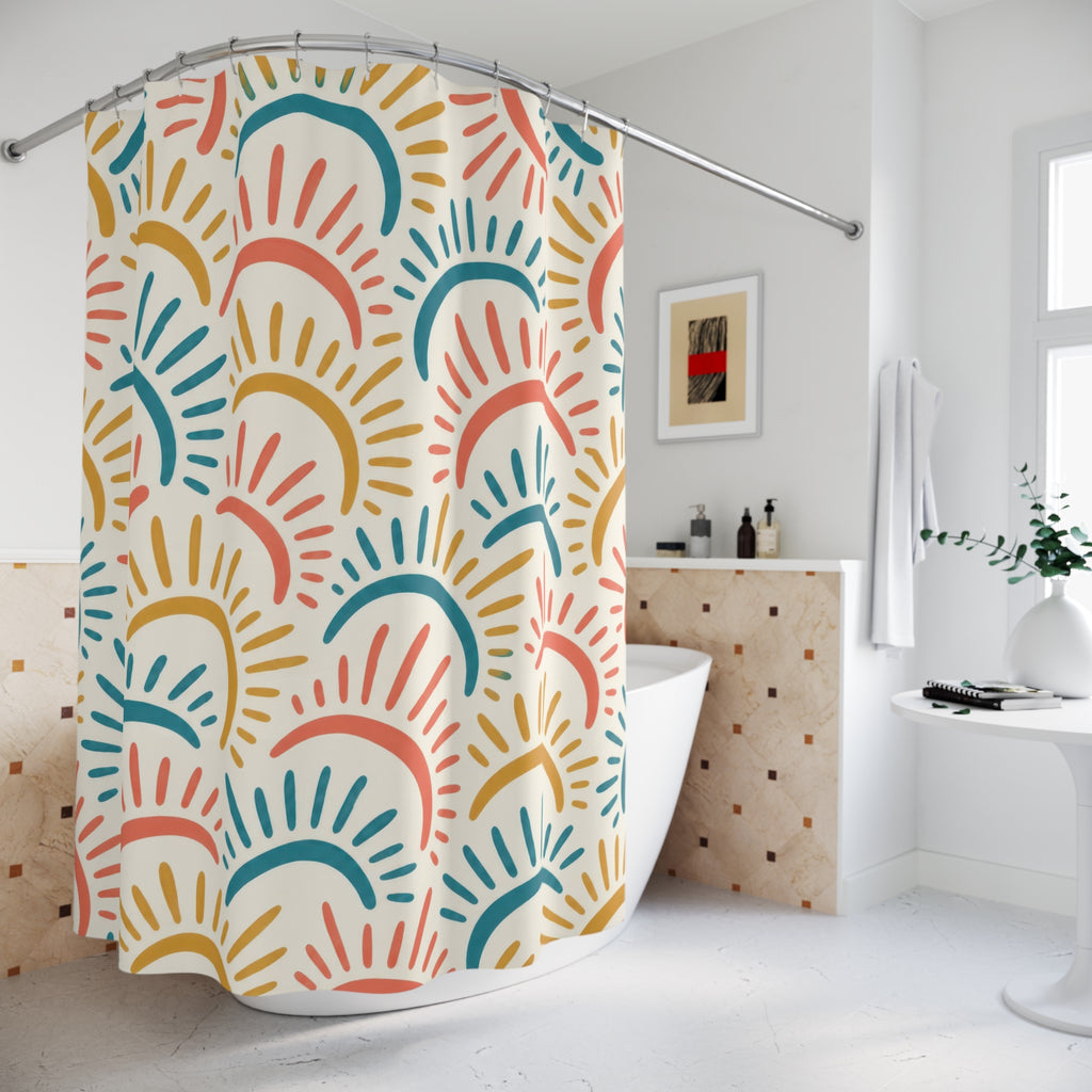 Coral, teal and ochre sun arcs with rays on ivory shower curtain beside a freestanding tub