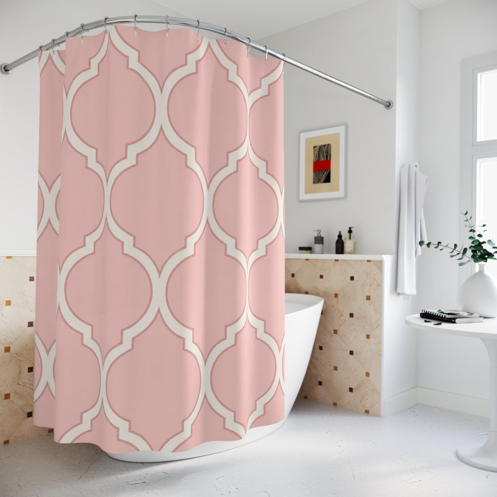 Blush pink and ivory repeating ogee curves shower curtain beside a freestanding tub