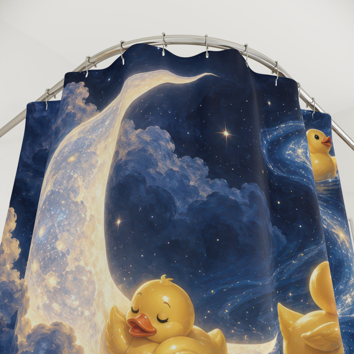 Rubber ducks beneath a moon in a blue starry sky shower curtain with close-up print, hooks, and folds