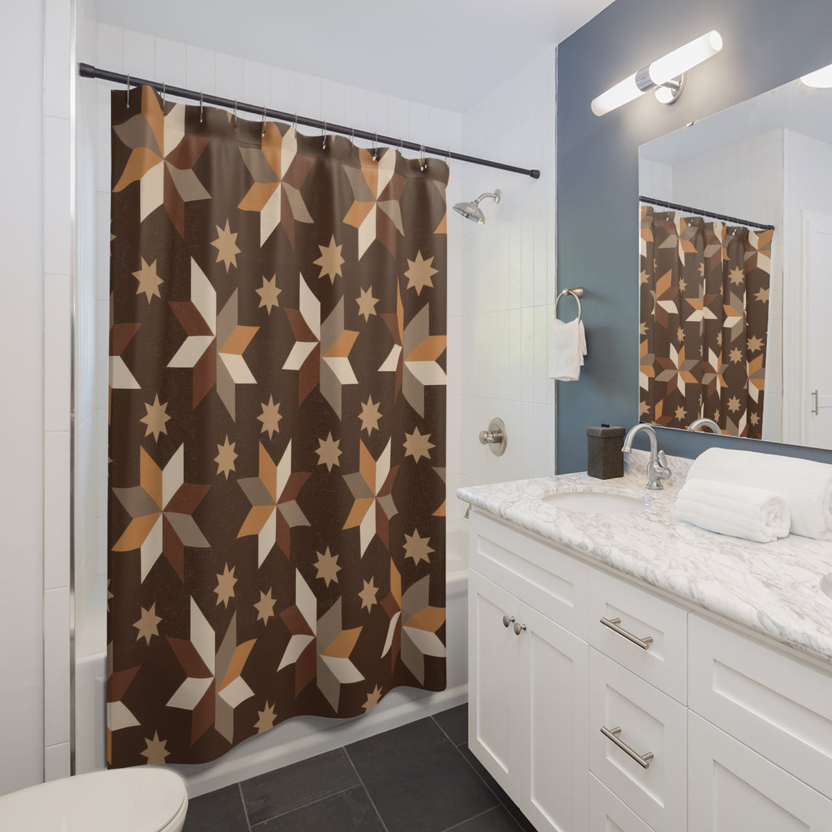 Caramel, taupe and cream folk stars on cocoa brown shower curtain beside a white vanity