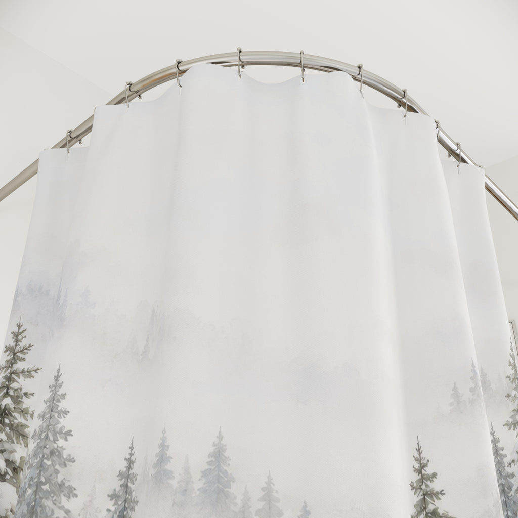 Snow-laden sage-gray pines in white mist and drifts shower curtain with close-up print, hooks, and folds