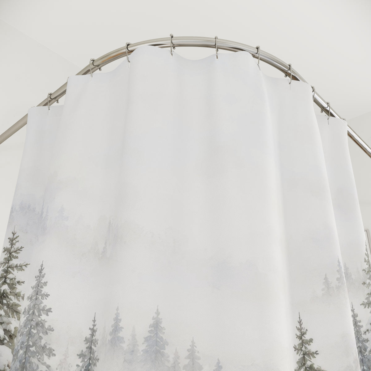 Snow-laden sage-gray pines in white mist and drifts shower curtain with close-up print, hooks, and folds