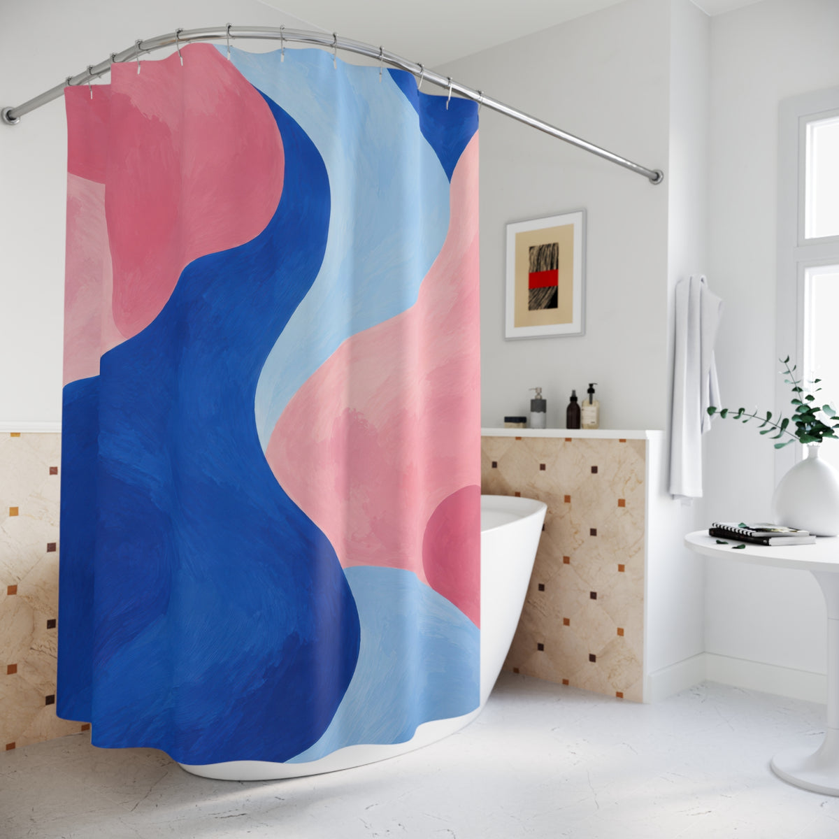 Cobalt blue curves between pink and pale blue abstract shapes shower curtain beside a freestanding tub