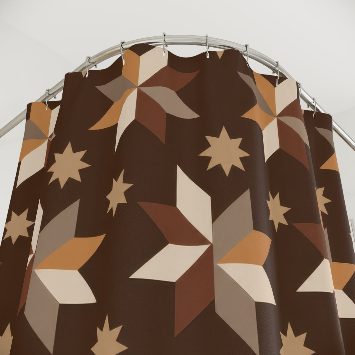 Caramel, taupe and cream folk stars on cocoa brown shower curtain with close-up print, hooks, and folds