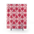 Pale pink bow ornaments on strawberry pink shower curtain with full front view