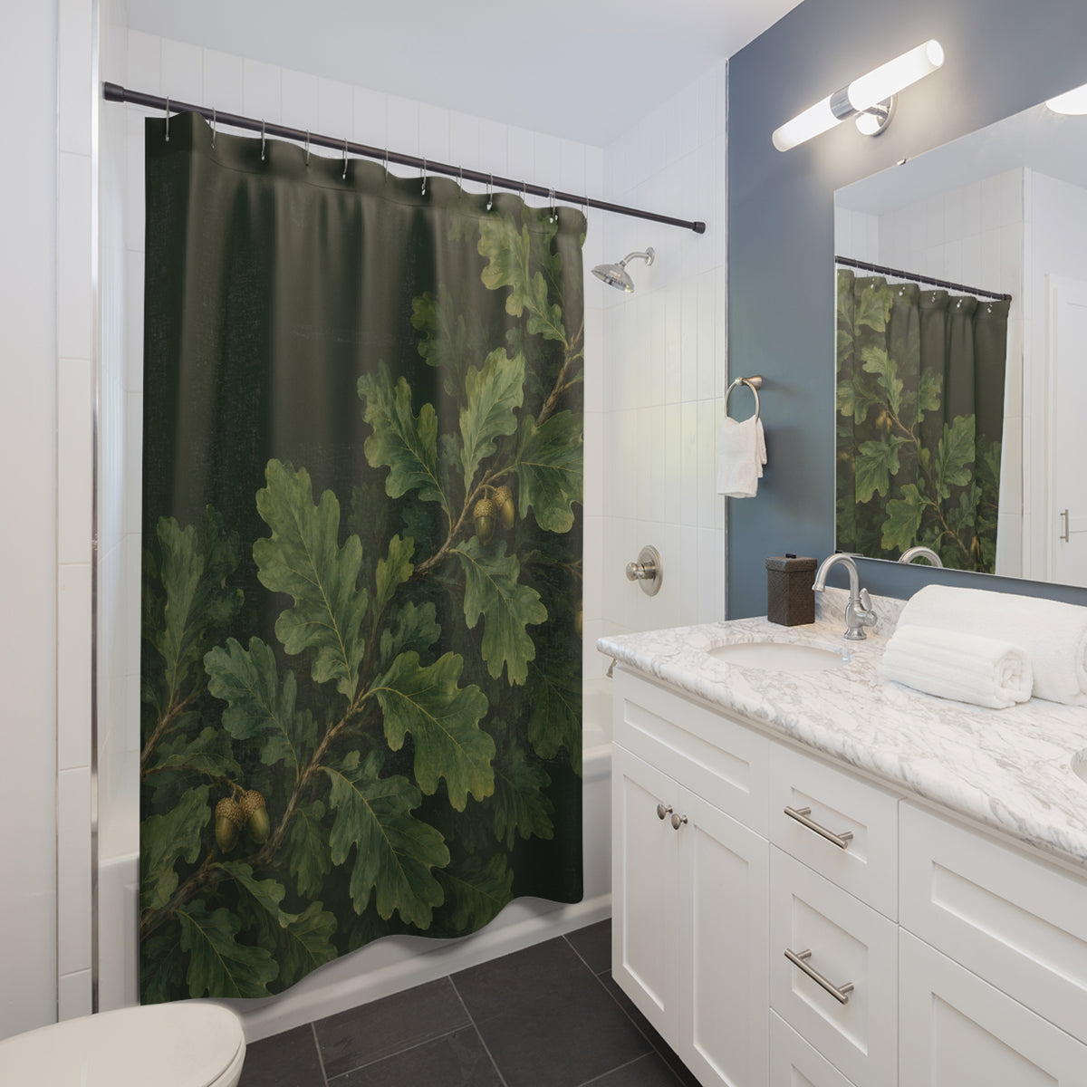 Oak leaves and acorns on forest green shower curtain beside a white vanity