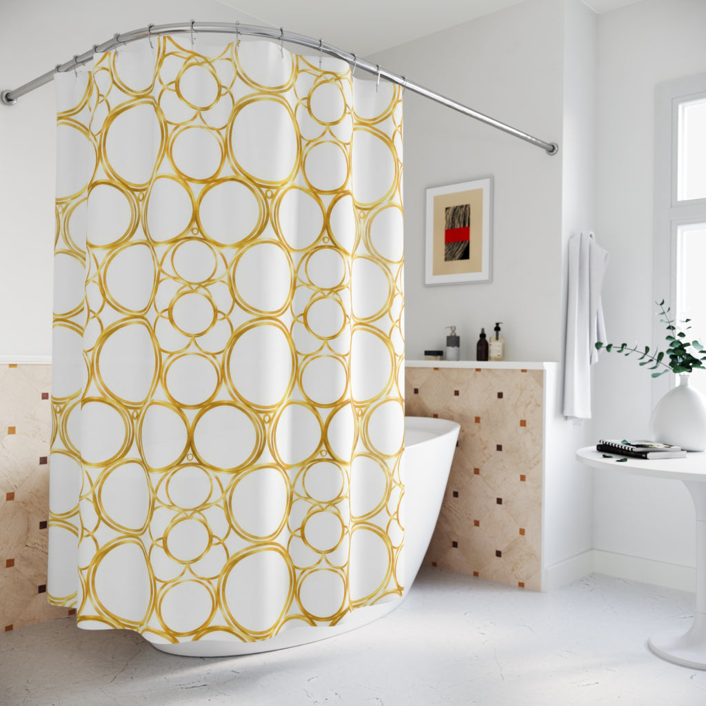 Gold halo circle pattern on warm white shower curtain beside a freestanding tub