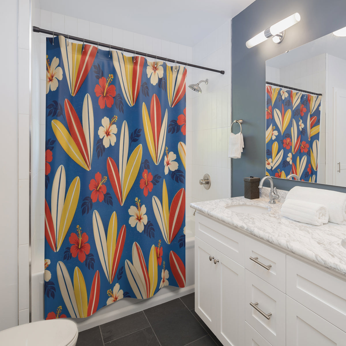 Hawaiian surfboards and hibiscus on blue shower curtain beside a white vanity