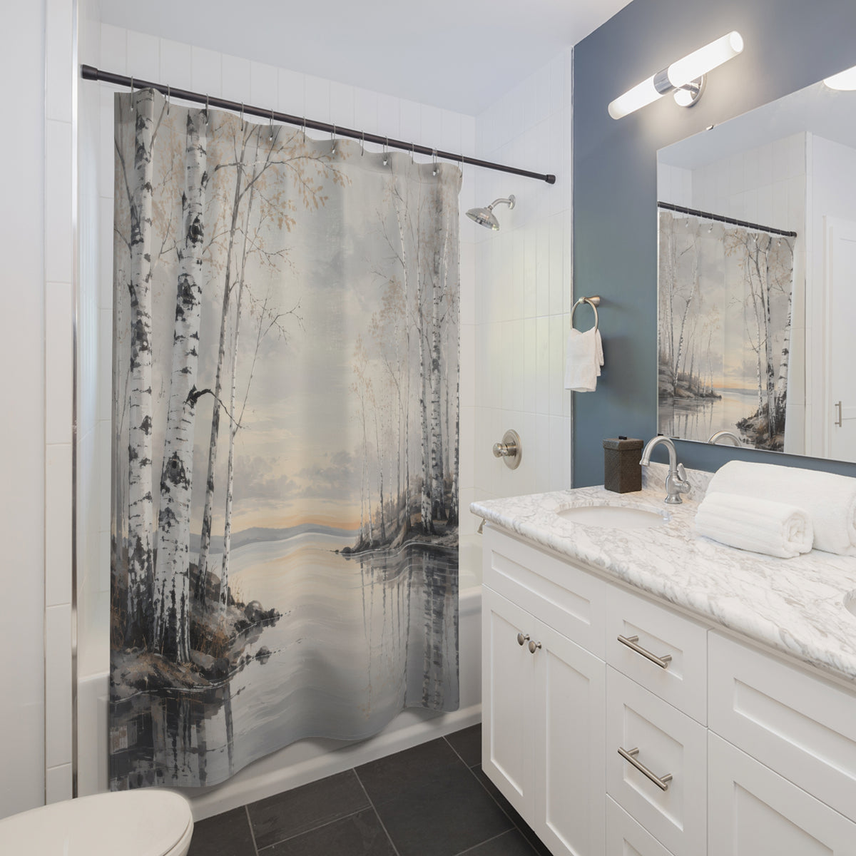 White birch trees beside a pearl-grey lake shower curtain beside a white vanity