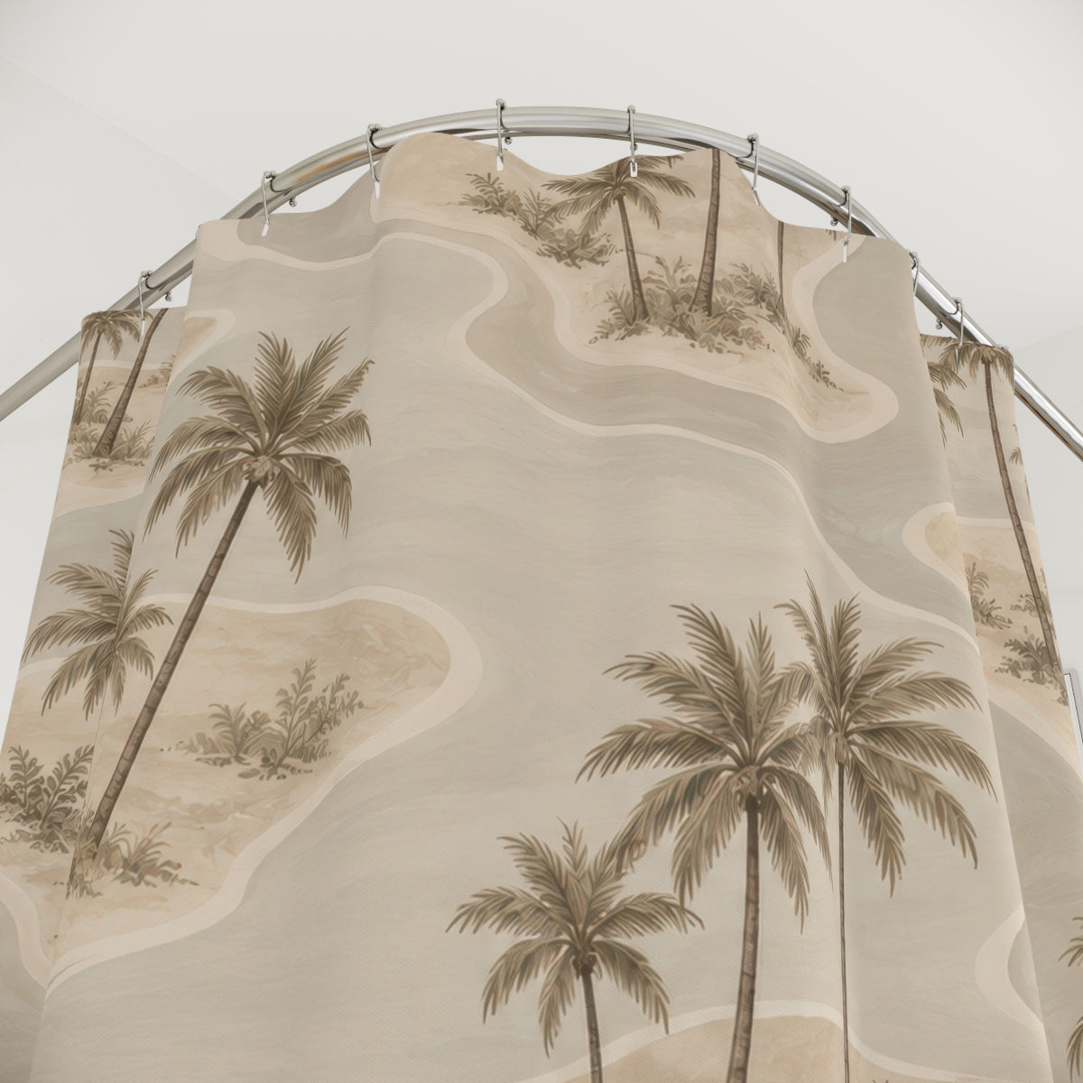 Taupe palm islands with beige and cream lagoon curves shower curtain with close-up print, hooks, and folds