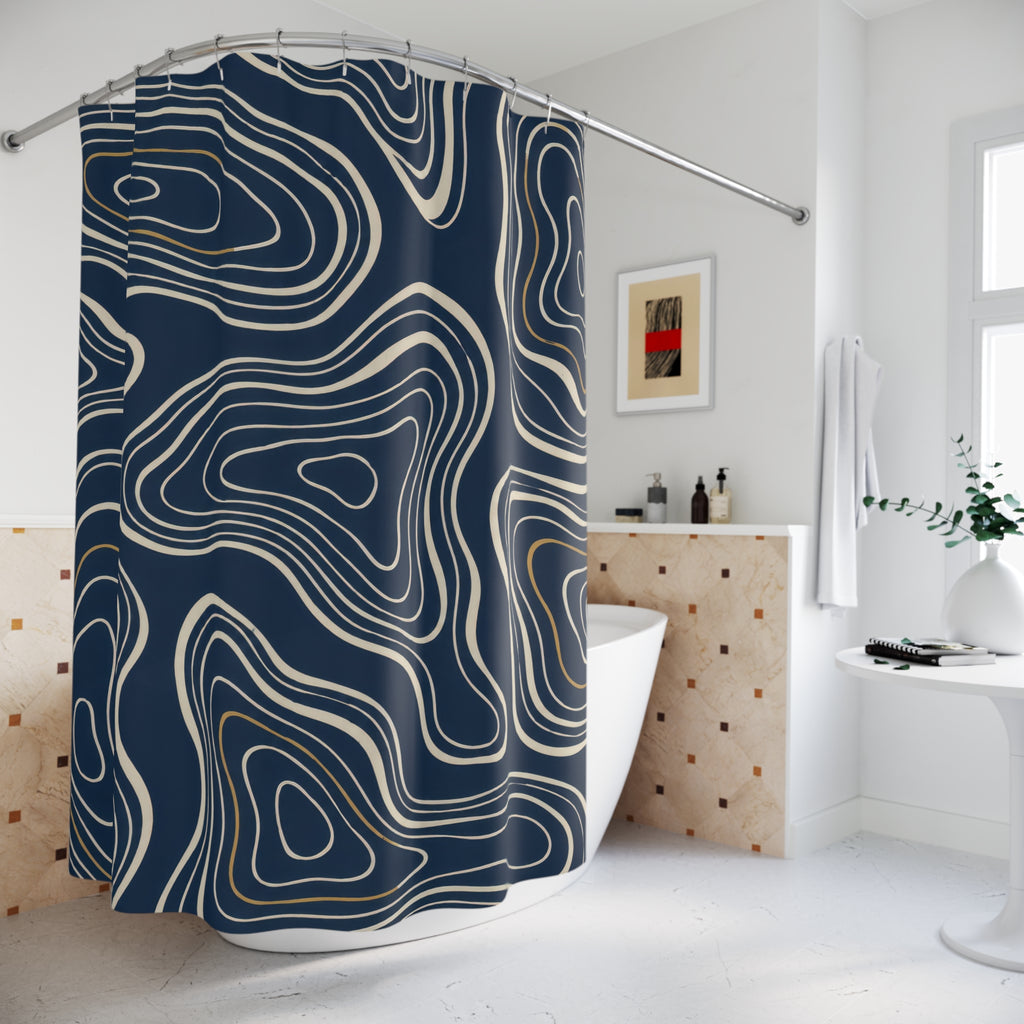 Cream nested contours and ochre accents on navy shower curtain beside a freestanding tub