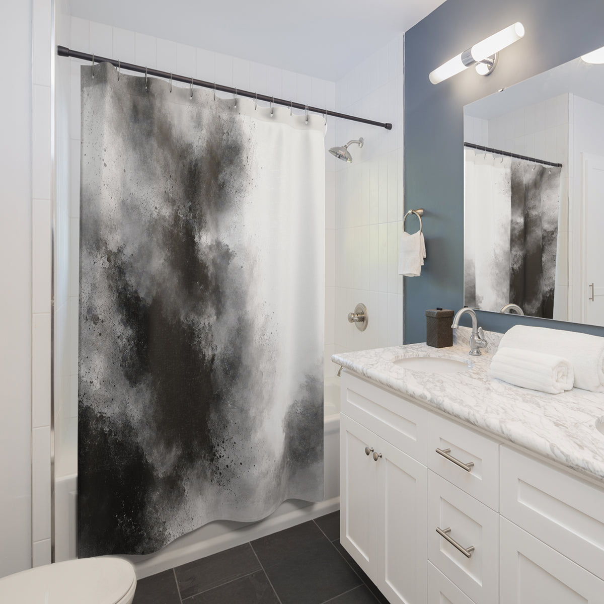 Black and gray granular ink washes beside open white space shower curtain beside a white vanity
