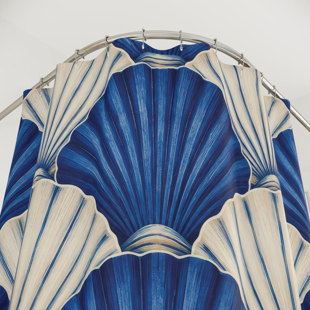 Overlapping cobalt blue and ivory scallop shells shower curtain with close-up print, hooks, and folds